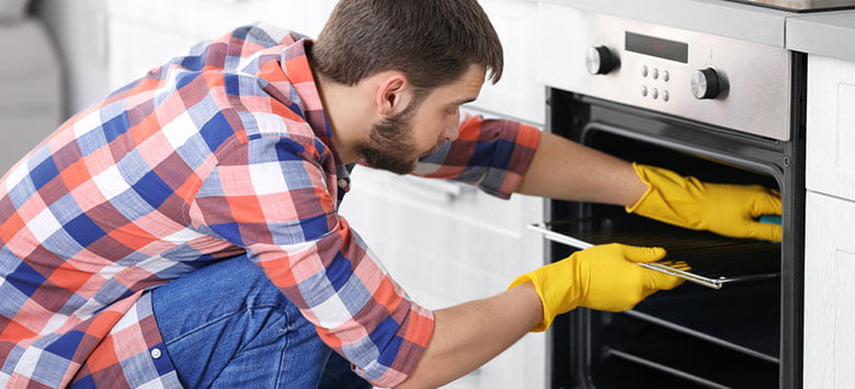 A guide on cleaning dirty oven racks with aluminum foil.
