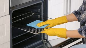 How to effectively clean different oven parts