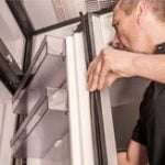 How to Fix a Refrigerator Leaking Water - Featured image