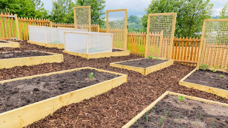 Decorating your raised garden bed area