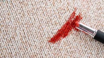 red lipstick on carpet